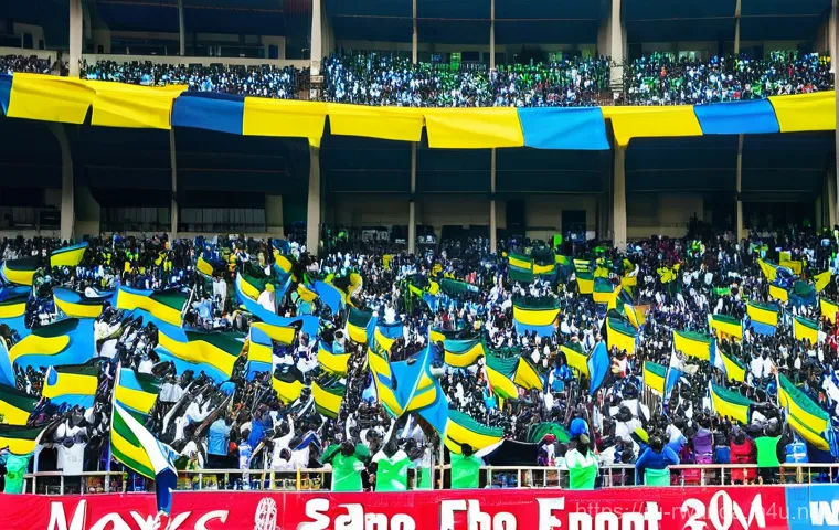 르완다의 주요 축구팀 - **Title:** Rwandan Derby Day Thrills
    **Prompt:** A dynamic, wide-angle shot of a packed Amahoro ...